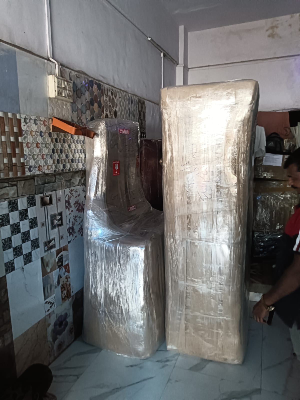 Fridge and mattress wrapped and ready for shifting in J B Nagar Andheri East